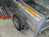 an image of a small trailer in a garage