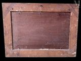an old wooden picture frame with a black background and a black background