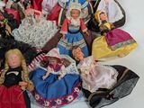a lot of dolls that are laying on the floor