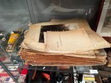 a stack of old papers on a glass shelf