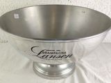 a silver bowl that is sitting on a table