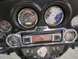 a close up of a motorcycle ' s dashboard with various gauges