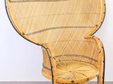 an image of a wicker chair in a room with a white wall