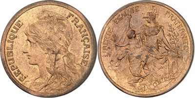 a close up of a coin with a woman on it