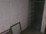 two empty picture frames sitting on the floor in a room