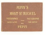un vieux livre dont la couverture est ornée d'une image de chien