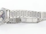 a watch that is laying on a white surface