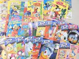 a lot of cartoon books that are on the table