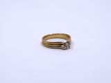 an image of a gold ring with a diamond on it