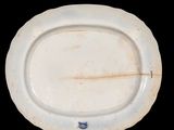 a white plate with a blue and white design on it