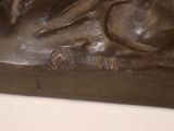 a bronze statue of a man with a horse on it
