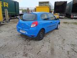 a blue car that is parked in a lot