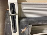 a machine that is sitting on the floor next to a wall