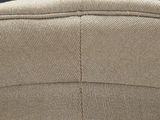 the back of a tan hat with a brown leather band