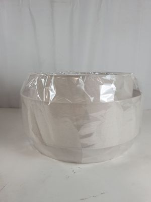 a roll of tape wrapped around a bowl on a table