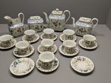 a lot of cups and saucers on the table