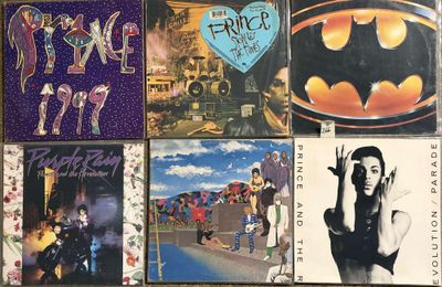 many different album covers on the wall