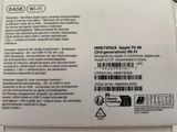 the back of an apple tv box with a sticker on it