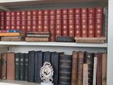 many books that are on the shelves in the room
