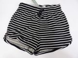 black and white striped shorts laying on a white surface