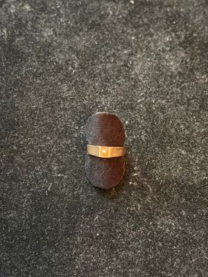 a ring that is on top of a piece of wood