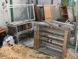 a pile of old windows and other junk in a room