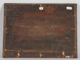 an old wooden box sitting on top of a table next to a white wall