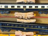 three train cars that are on display in a box