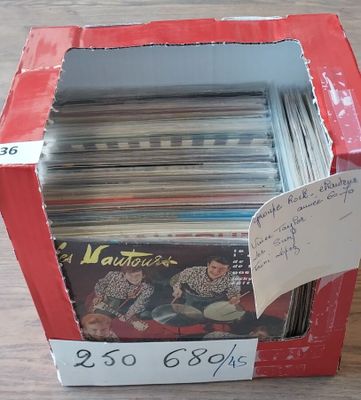 a red box with a lot of records in it