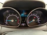 a close up of a car dashboard with gauges and speedometers