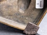 a close up of a metal object with a tag on it