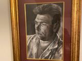 painting of a man in a cowboy shirt is hanging on a wall