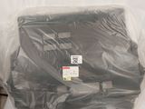 a bag of luggage sitting on a bed in a room