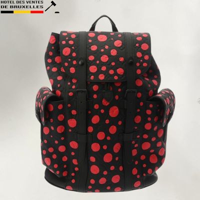 red and black polka dot print backpack with black straps