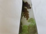 a vase that has a picture of a tree on it