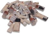 a pile of tubes of paint on a white surface