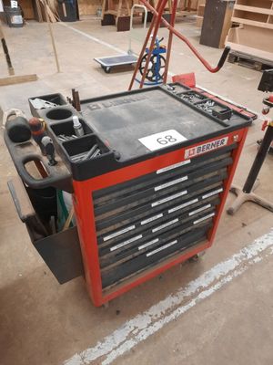 a workbench with tools on it in a garage