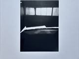 an image of a black and white photo of a bed in a room