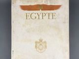 an old book with an eagle on the cover