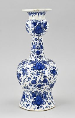 blue and white vase with blue flowers on it