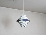 a paper hanging from the ceiling of a room