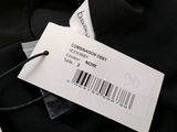 the label on a black shirt has a barcode on it
