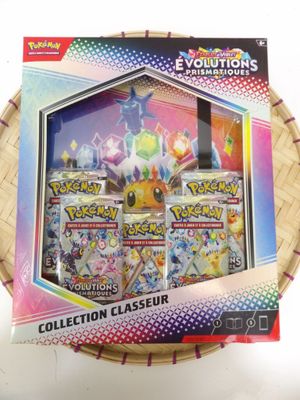 the box contains a collection of pokemon cards and a box of cards