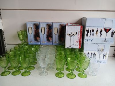 a lot of green glassware on the counter