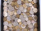 a box full of coins sitting on a table