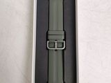 an apple watch band in a box on a white surface