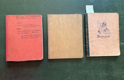 three books sitting on top of a table next to each other