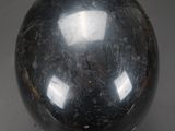an image of a black marble ball with a sticker on it