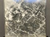 an old photo of a picture of a city with smoke coming out of it