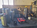 a table with various tools on it in a garage